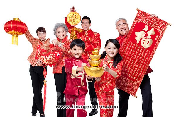 Family Dressed in Traditional Clothing Celebrating Chinese New ...